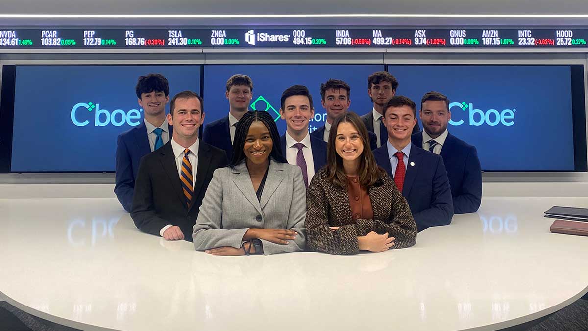 Group of students in front of a stock ticker