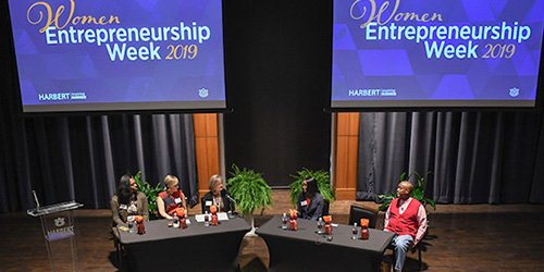 Far shot of the speakers at the Women in Entrepreneurship Week panel