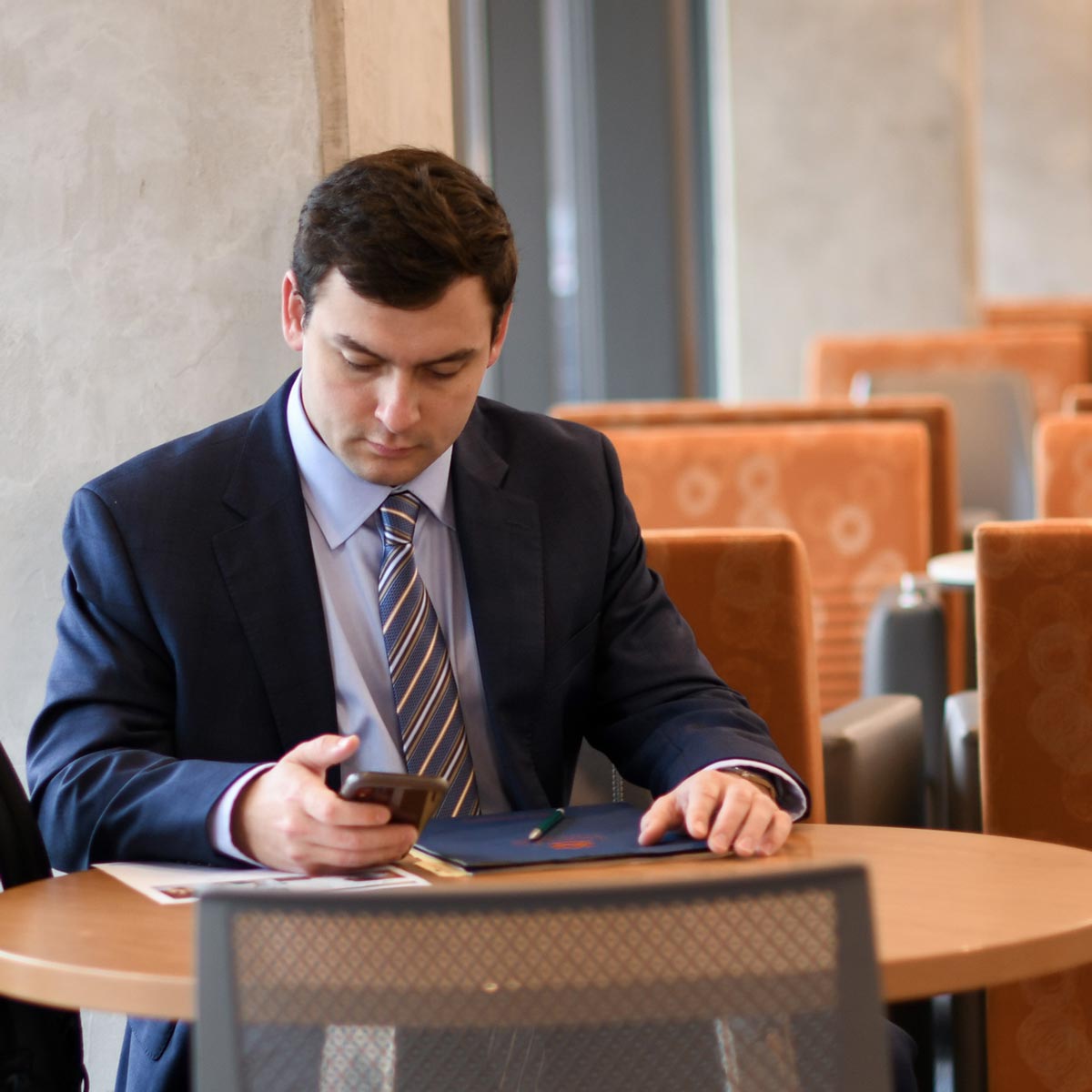 student working in a suit