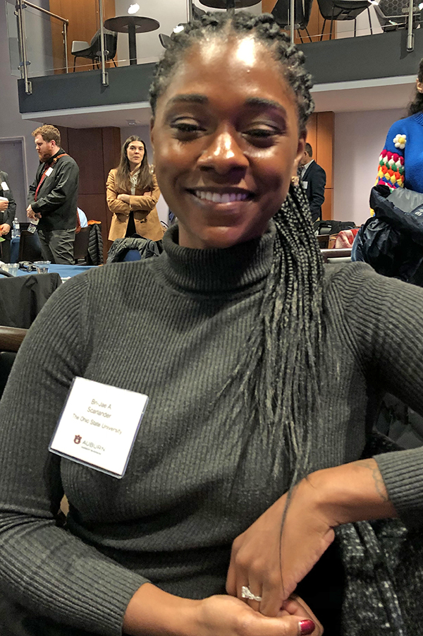 Woman seated at conference