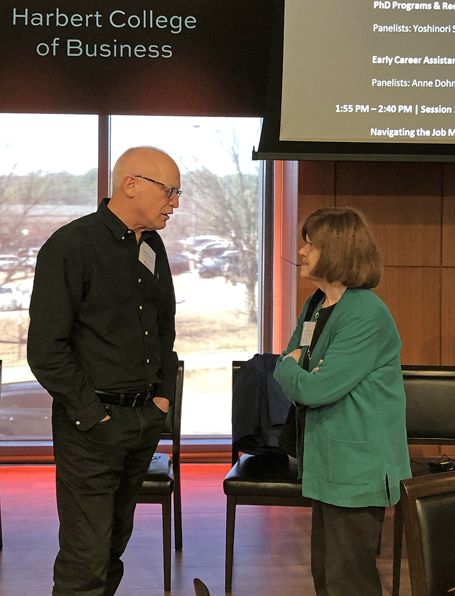 Woman and man standing and talking