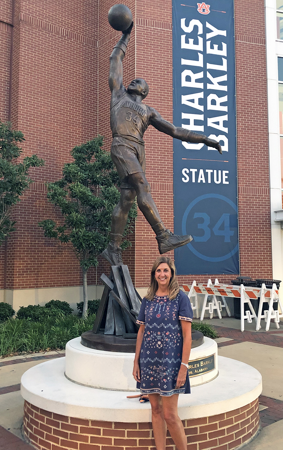 Woman standing at Barkeley statute
