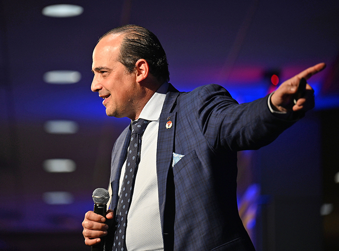 Man talking with microphone in hand