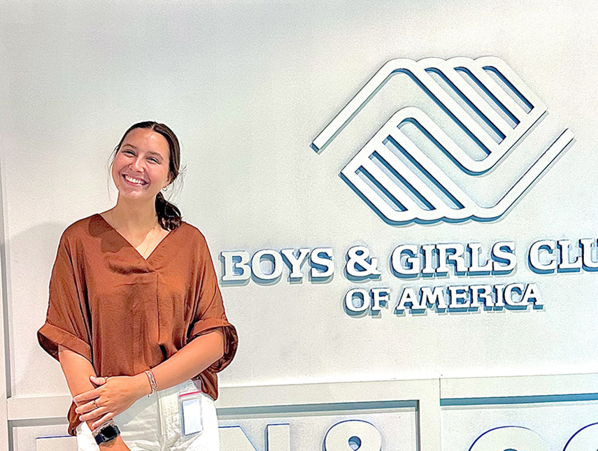 Intern Kylah Hosman Boys & Girls Club sign