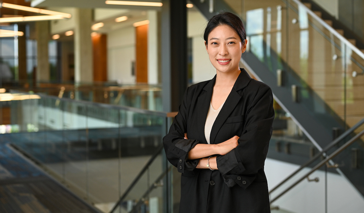 Woman standing with arms crossed