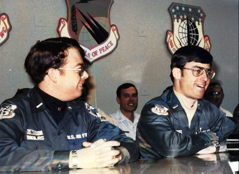 Two air force officers sitting down