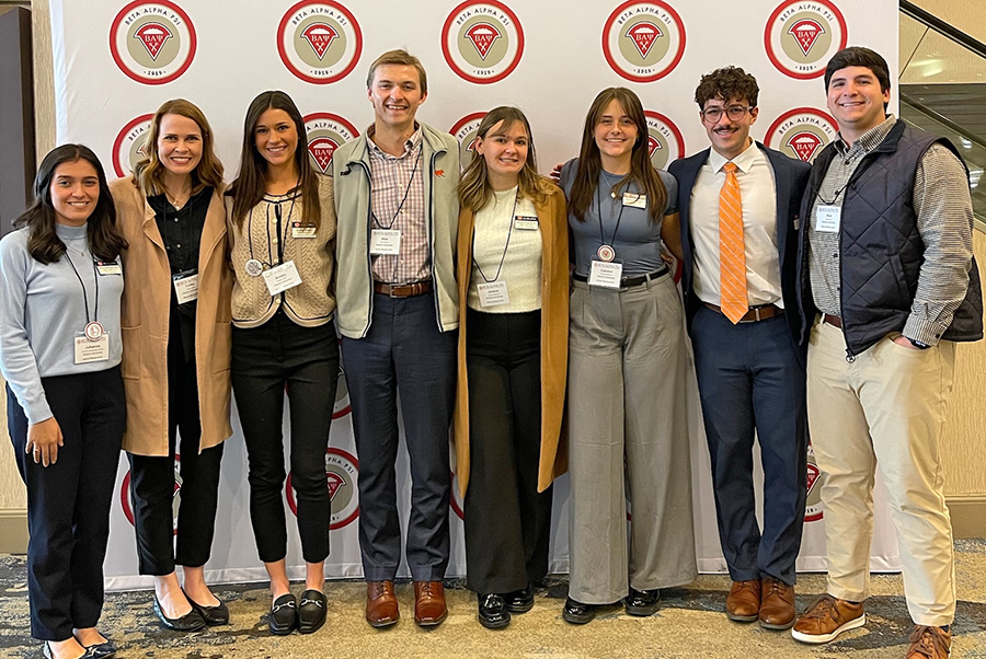 Group of people posing for photo