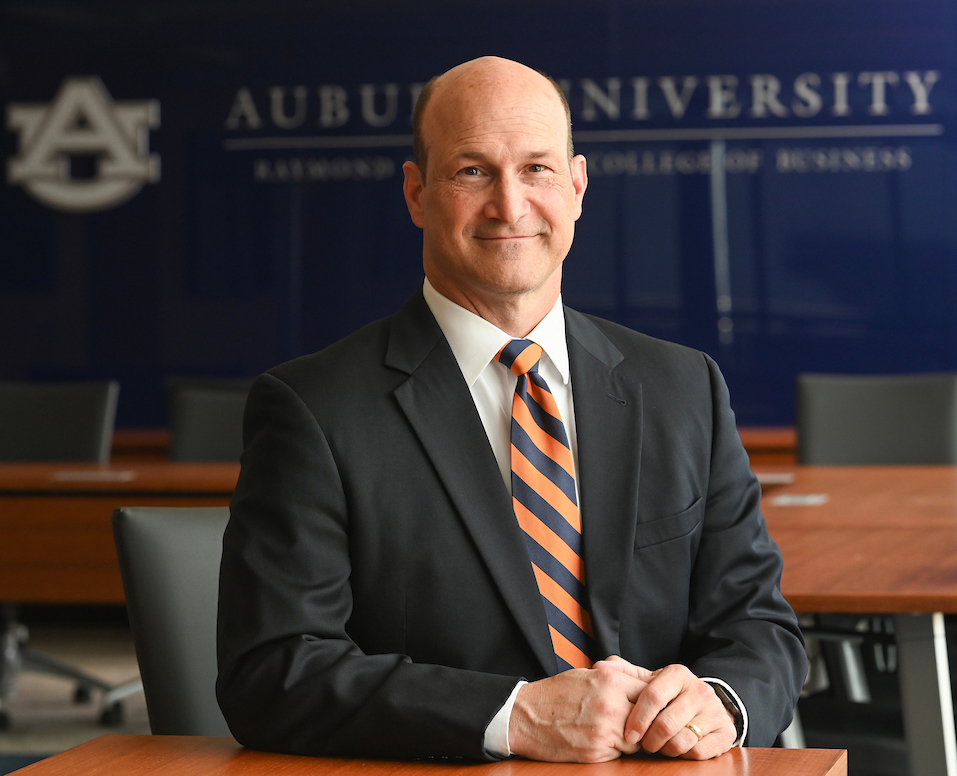 Oprandy sitting at desk
