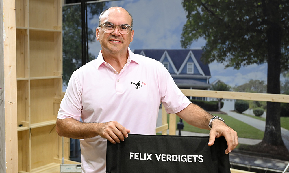 Felix Verdigets Man standing by chair