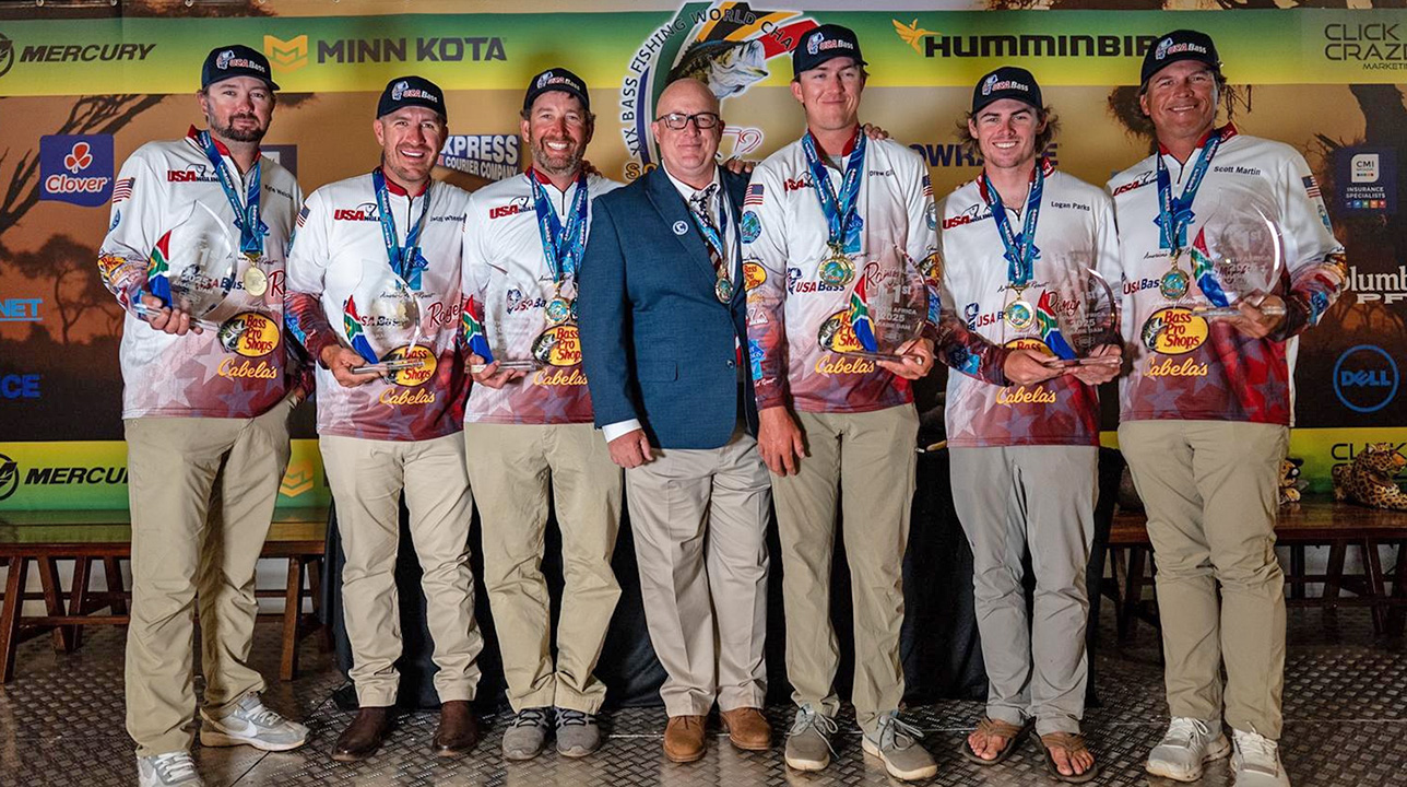Fishermen holding trophy