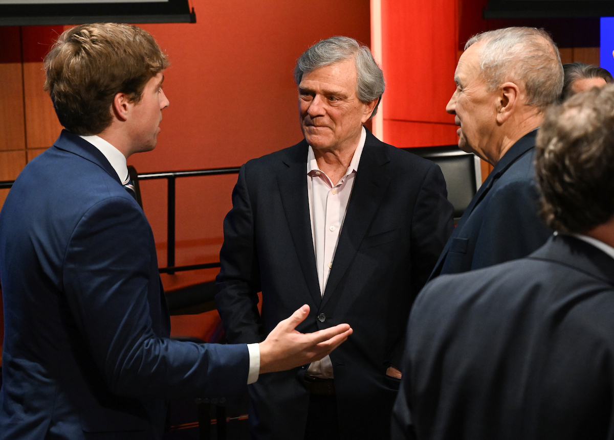 3 men talking