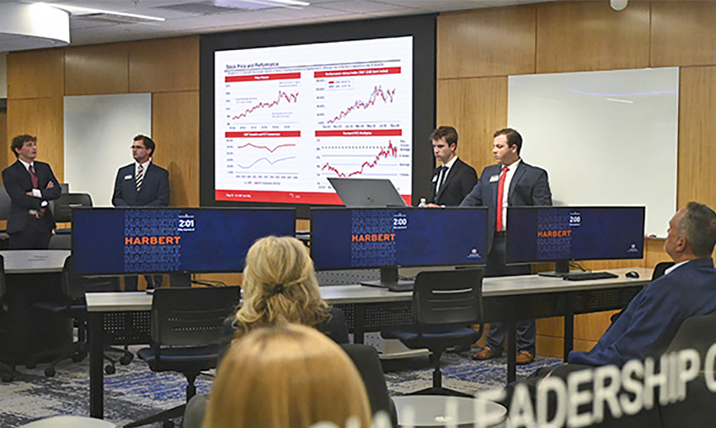 4 people giving presentation