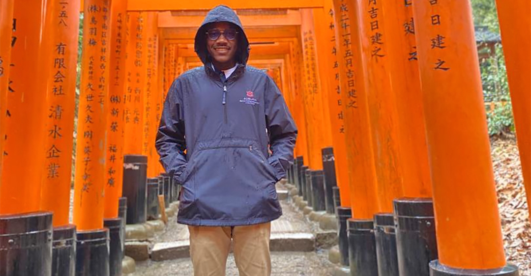 Man standing by bridge