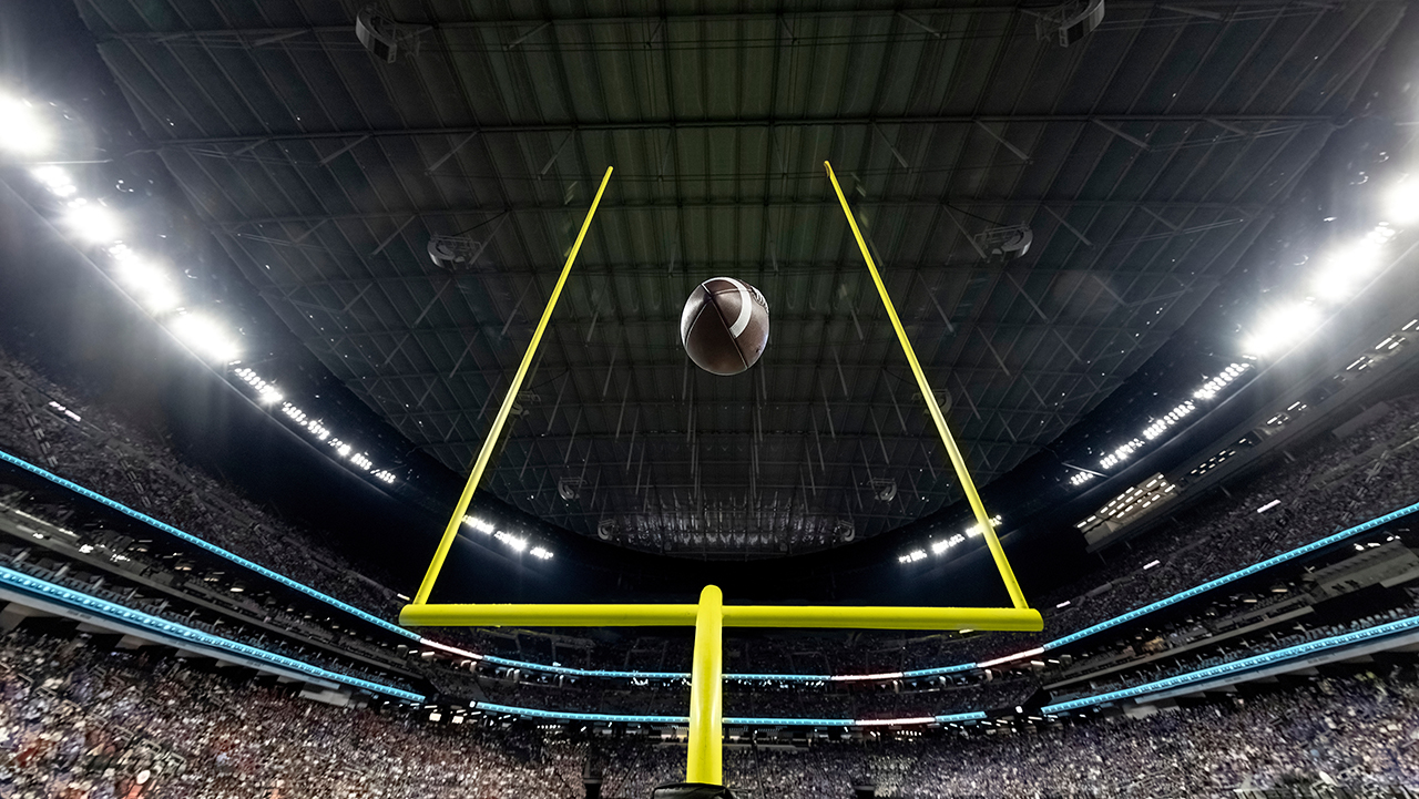 Football sailing through goalposts