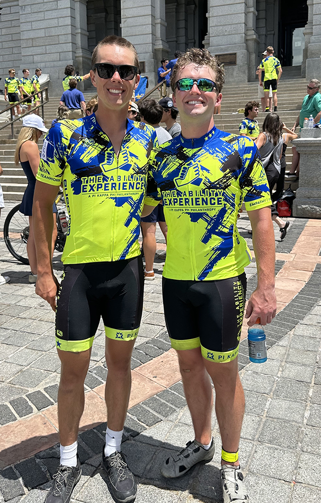 Two cyclists standing together