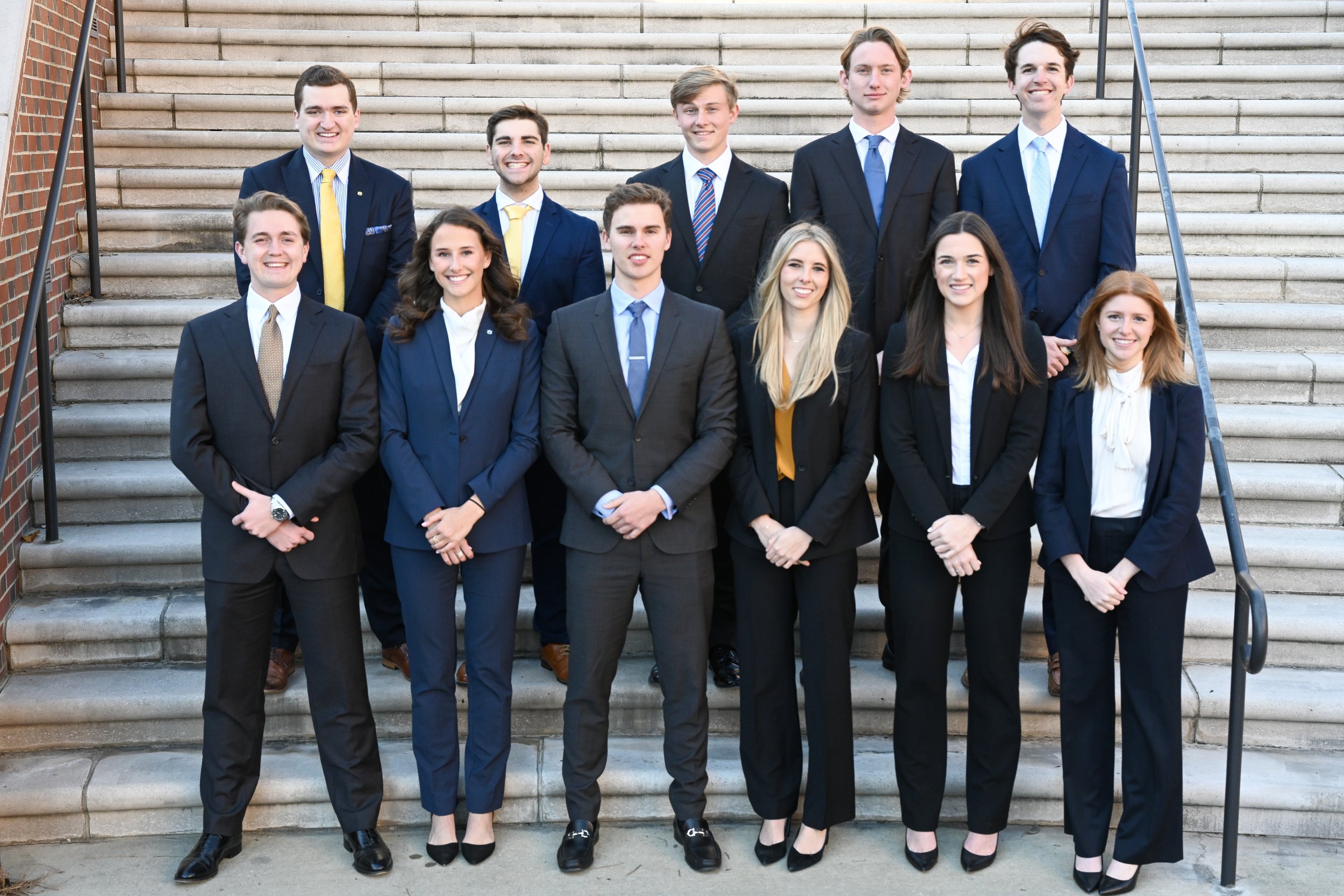 FMA student exec committee FMA student executive committee standing on stairs