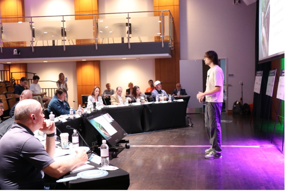 Student pitching idea to judges