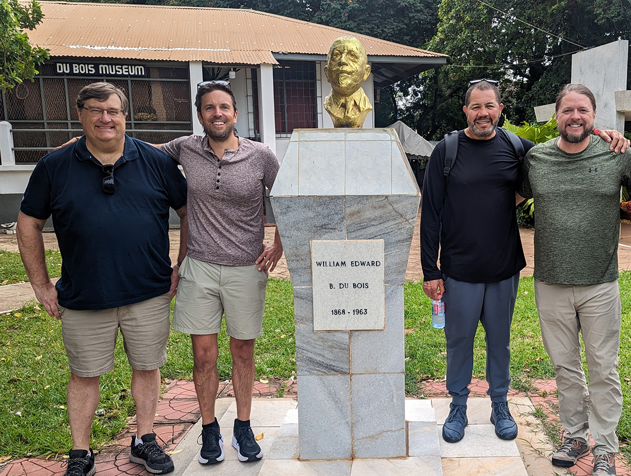 Four Auburn professors standing in front of museum