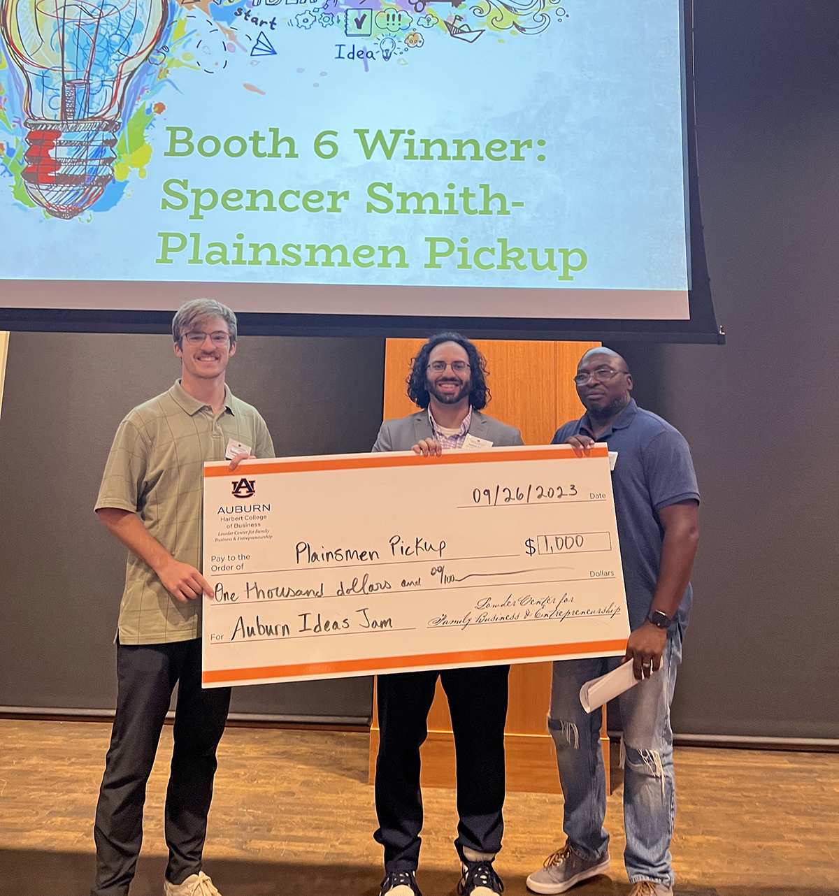 Plainsmen Pickup team with Josh Sahib holding check