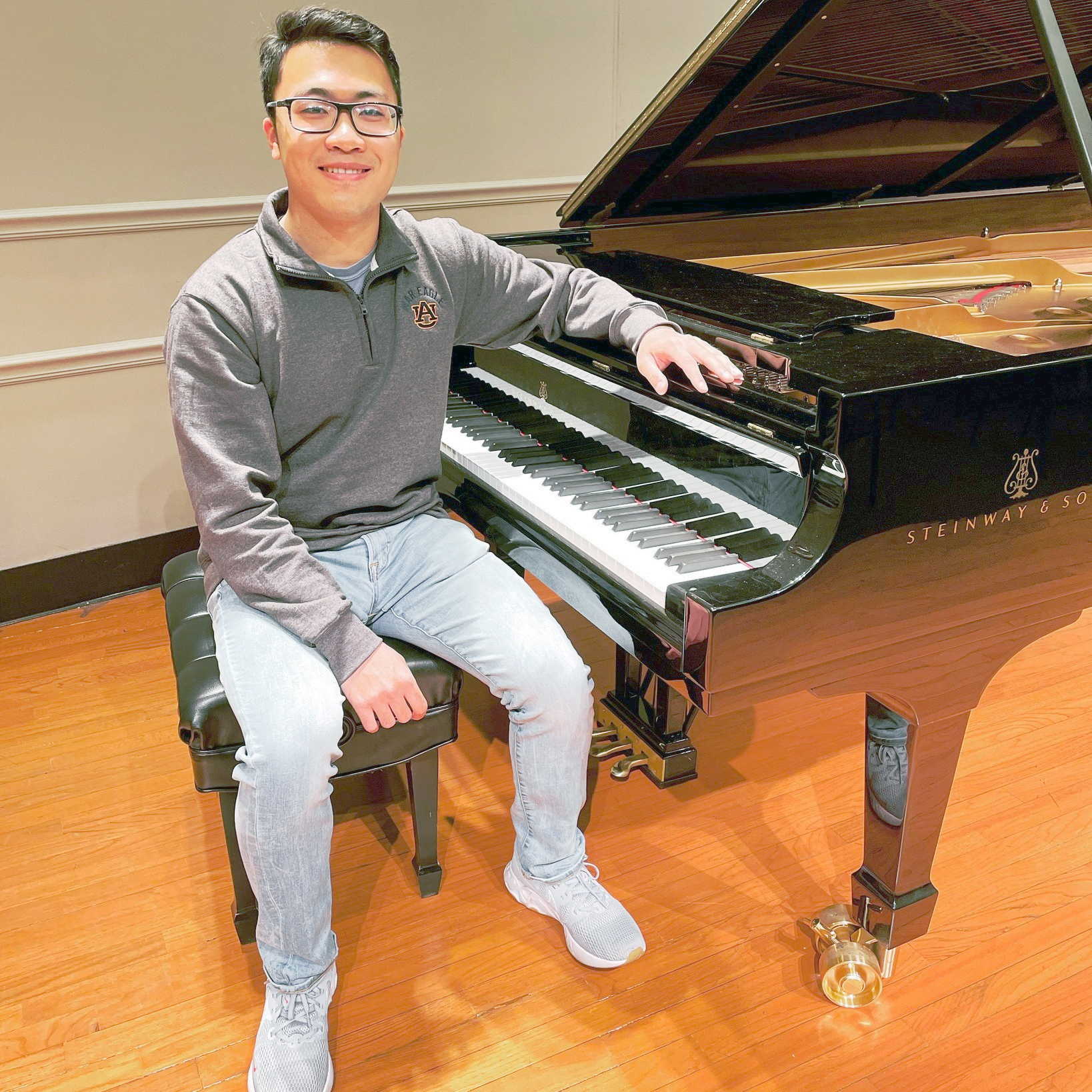 Jackson Chen sitting at piano