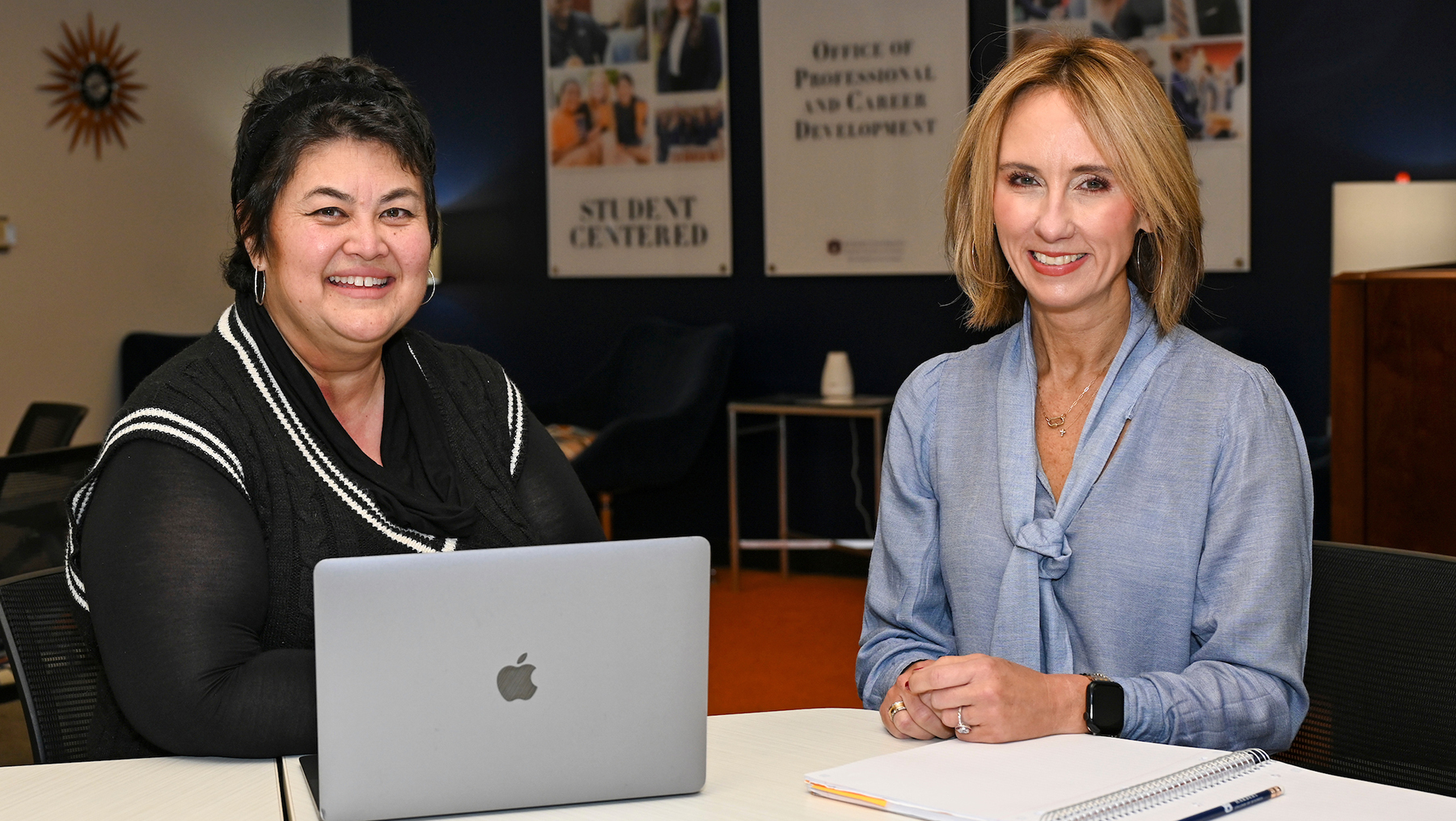 Marianne McCarley, Michelle Keesee sitting at table