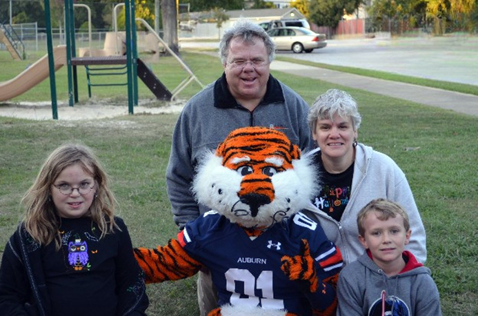 Stanwick family Stanwick family posing with Aubie in park