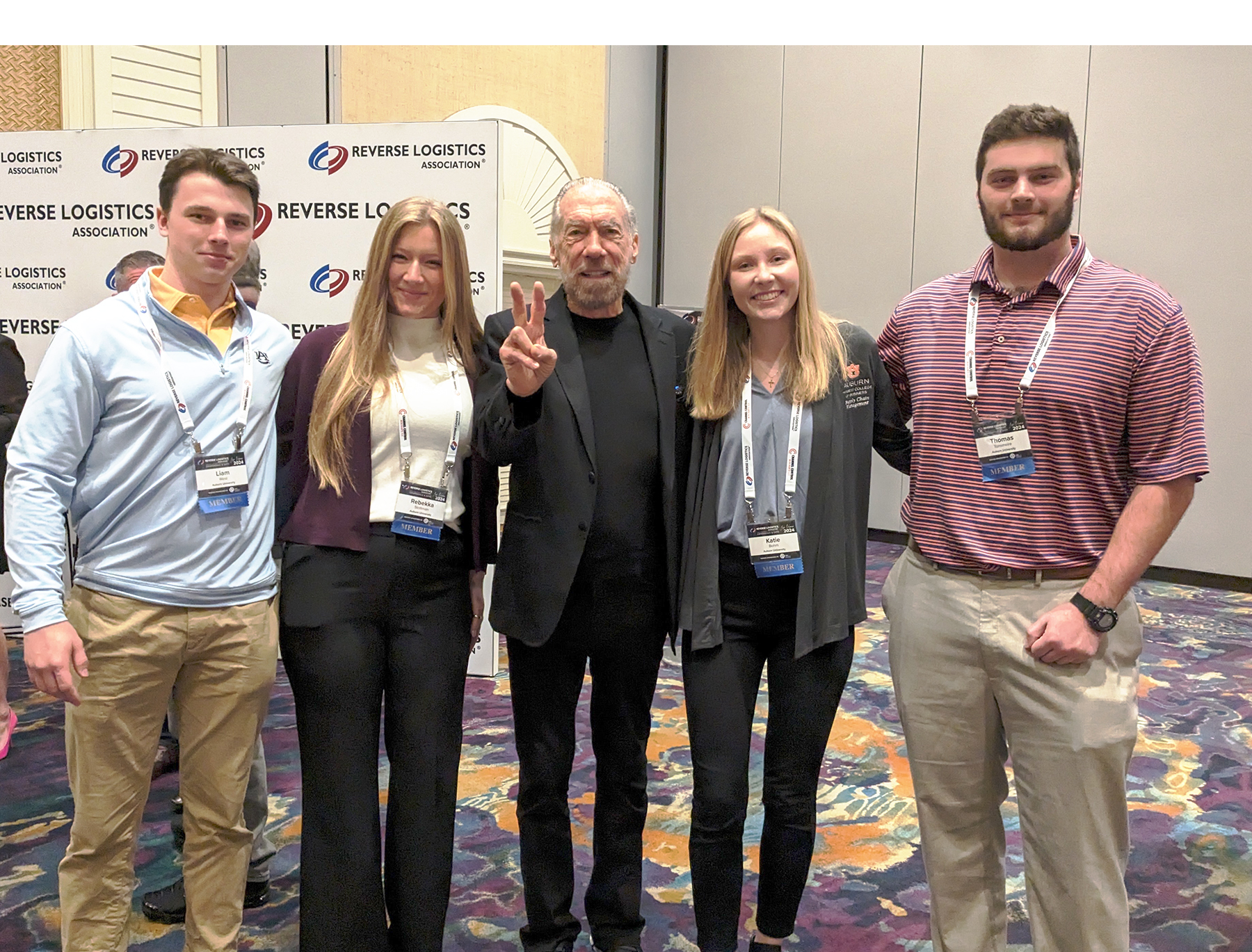 SCM students at RLA24 conference Four Auburn SCM students standing with Paul Mitchell