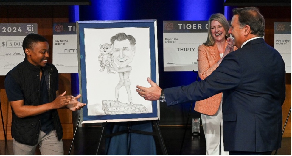 Student Marandu giving alum Forchette portrait