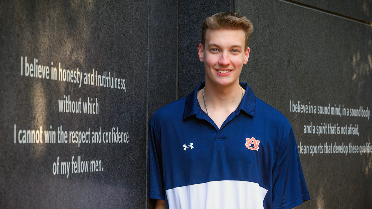 William Olmstead standing next to Auburn Creed